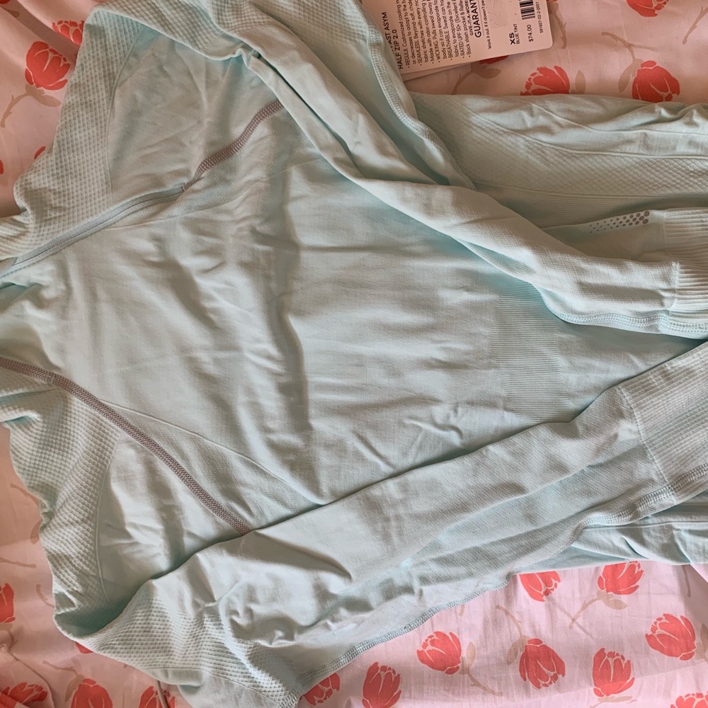 Running asymmetrical half zip